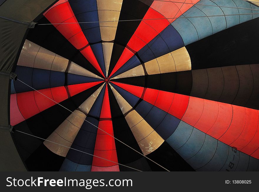 Looking up to see an inside colorful balloon. Looking up to see an inside colorful balloon