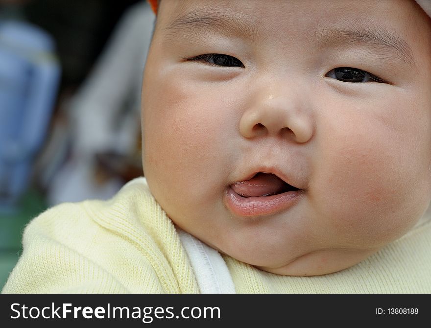 A cute baby with lively face.