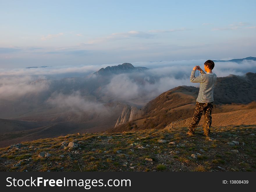 Hiker take a picture in mountains