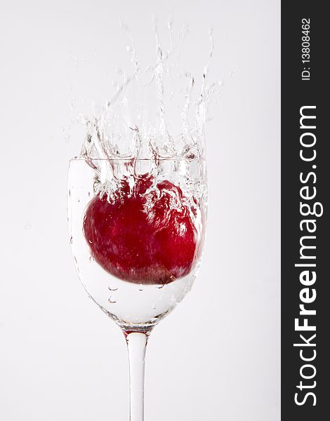 Splash of water with cherry fruit