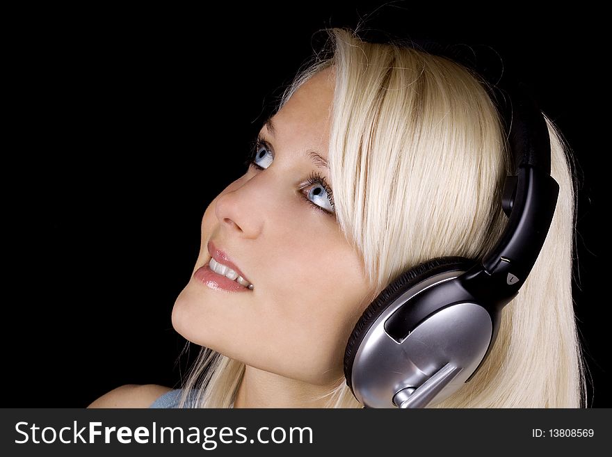 Blond girl with headphone in profile. Blond girl with headphone in profile