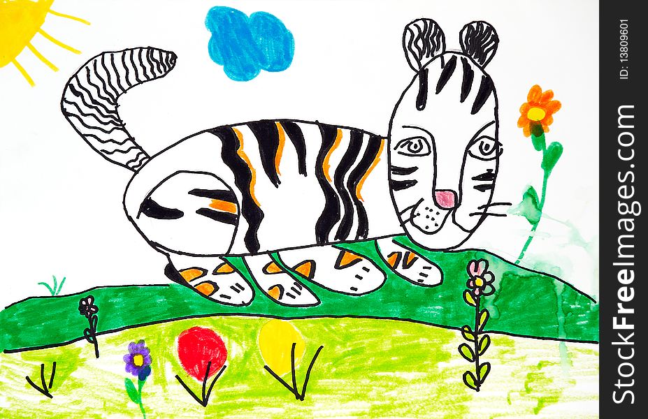 Striped cat for a walk on the sunny meadow