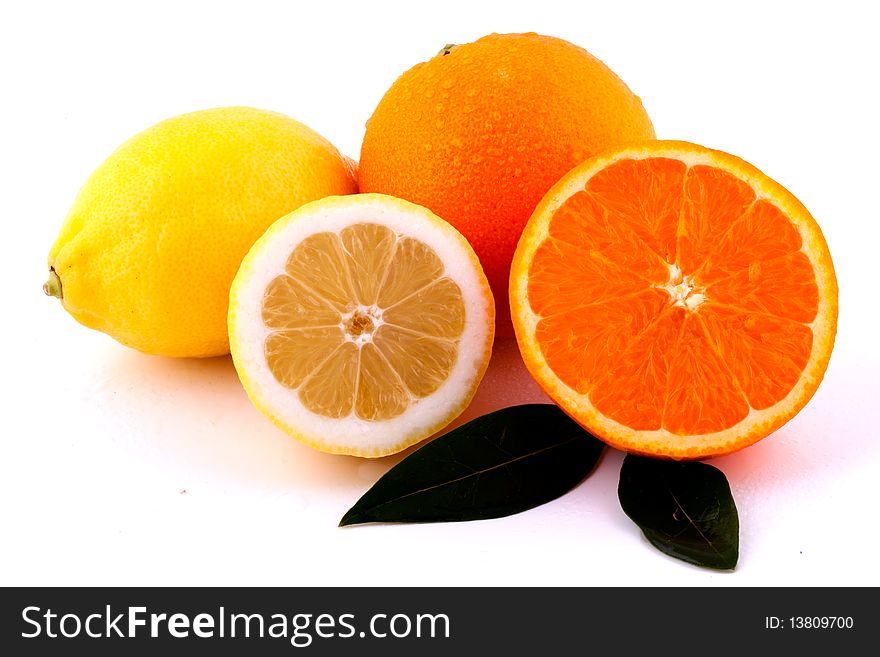 Oranges and Lemons Whole and Halves on White Background