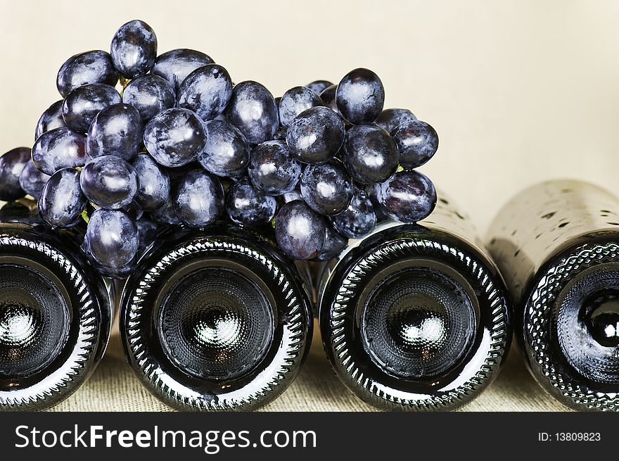 Bottles of red wine with fresh grapes. Bottles of red wine with fresh grapes