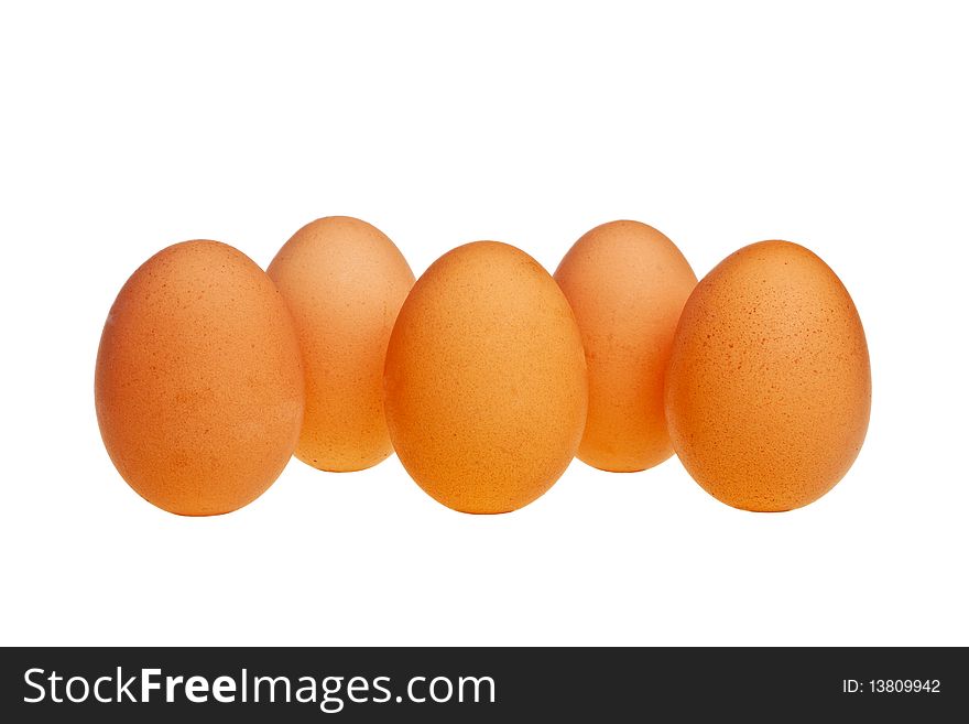 Five brown eggs in vertical position isolated over white background. Five brown eggs in vertical position isolated over white background.