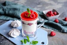 Layered Dessert With Crushed Meringue Kisses, Curd, Raspberries And Whipped Cream Stock Photo