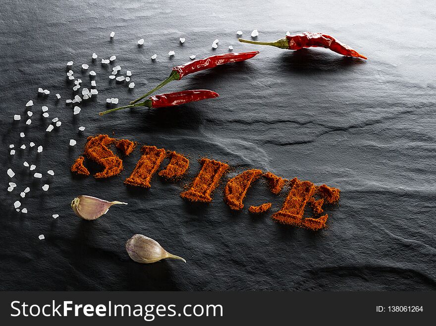 Spice. Ground paprika, chili pepper, garlic and sea salt close up