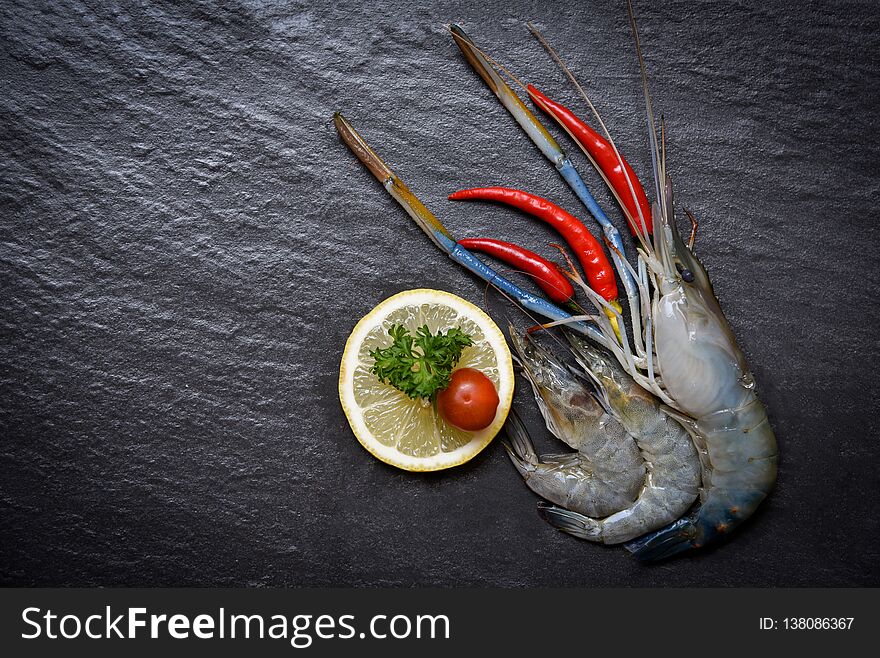 Seafood Shrimps Shellfish / Fresh prawns ocean gourmet raw shrimp with chilli tomato lemon and green parsley