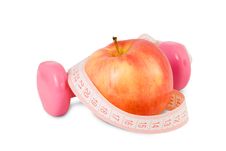Pink Dumbbell And Red Apple With Measuring Tape Stock Photography