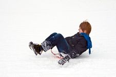 Child Sledding Down The Hill In Snow, White Winter Royalty Free Stock Images