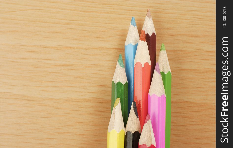 Colored Pencils on wooden desk