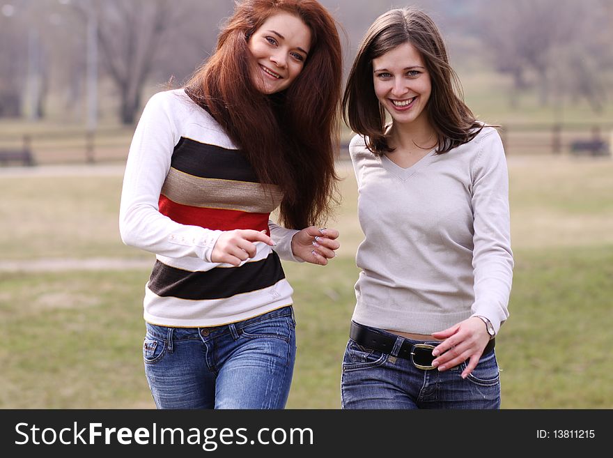 Cheerful girls in the spring park