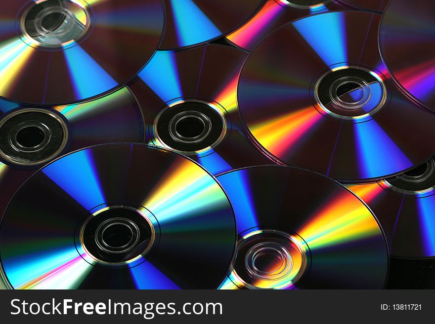 Five compact discs on a white background. Five compact discs on a white background