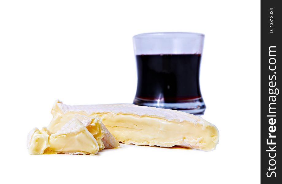 Brie cheese and gas of red wine isolated on white. Brie cheese and gas of red wine isolated on white