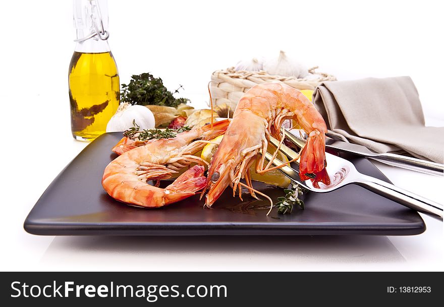 Barbequed prawn salad with lemon, macro closeup