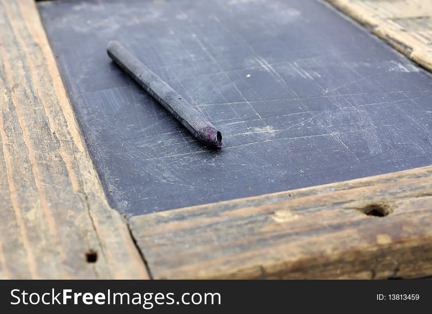 Antique tablet and writing implement.