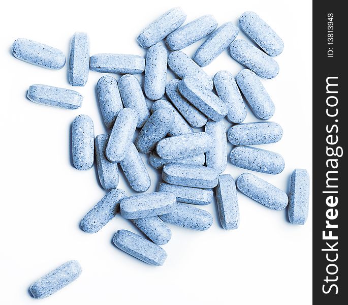 Macro Of Blue Pills Isolated On White Background