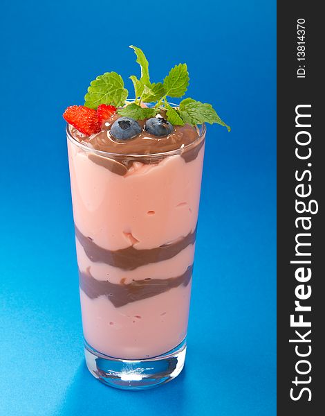 Strawberry chocolate dessert decorated with berry and mint