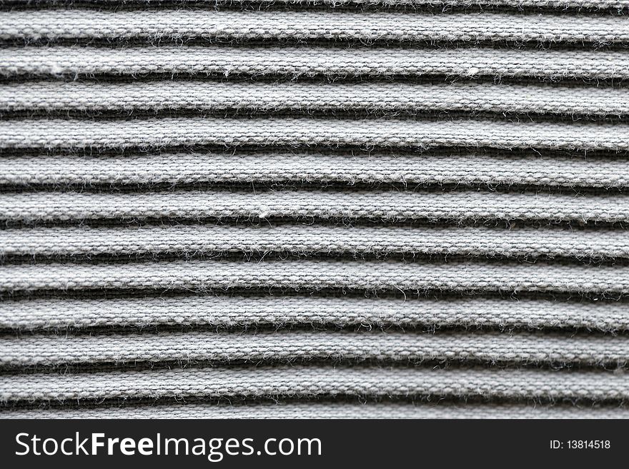 Cotton fabric in fringes or stripes as texture or background. Cotton fabric in fringes or stripes as texture or background.