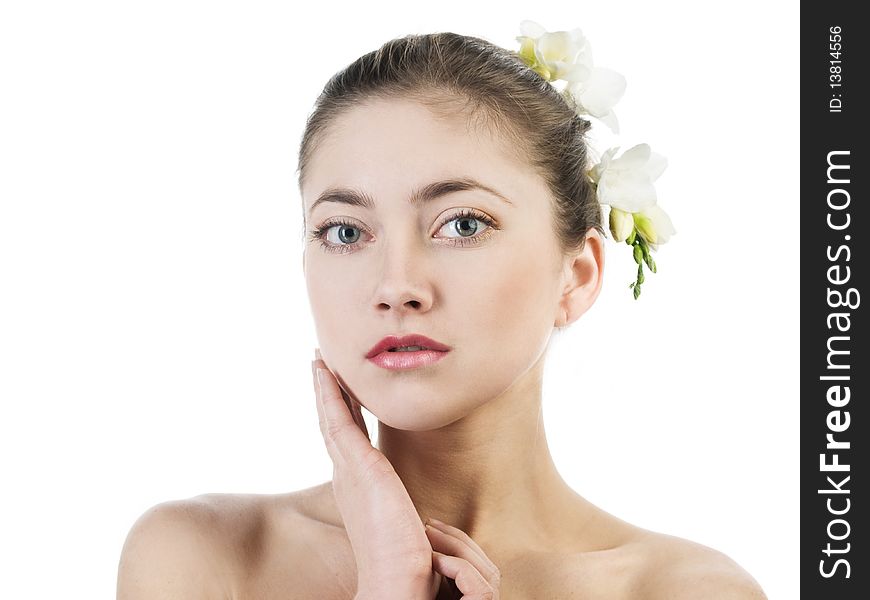 Portrait of beautiful girl with white freesia on grey background. Portrait of beautiful girl with white freesia on grey background