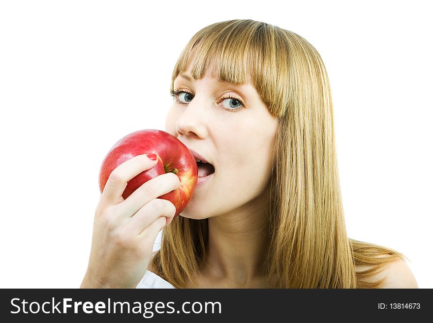 Young beautiful woman with a red apple on a white background