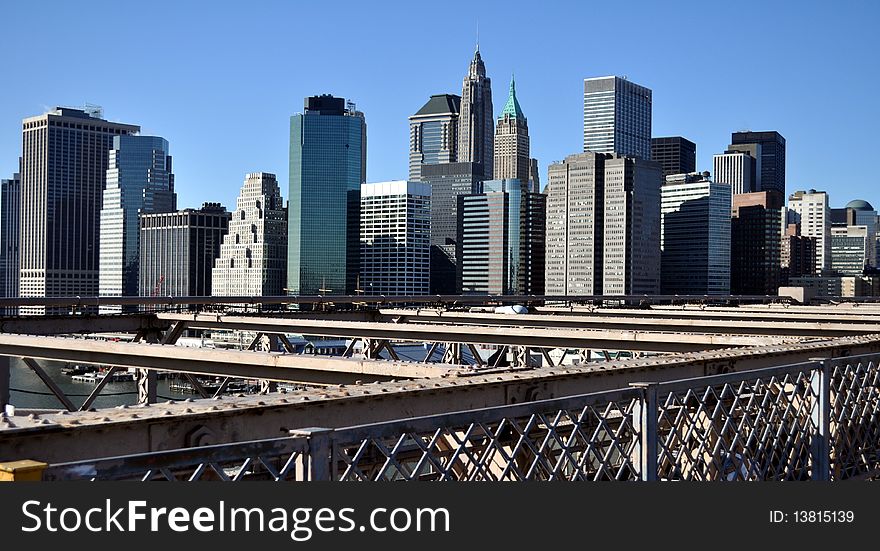 Scenic view of Lower Manhattan skyline with Brooklyn Bridge in foreground, New York city, U.S.A.