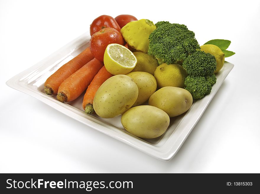 Vegetables and fruit in a plate - organic and healthy eating. Vegetables and fruit in a plate - organic and healthy eating