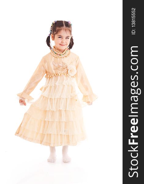 The little girl in a dress isolated on a white background