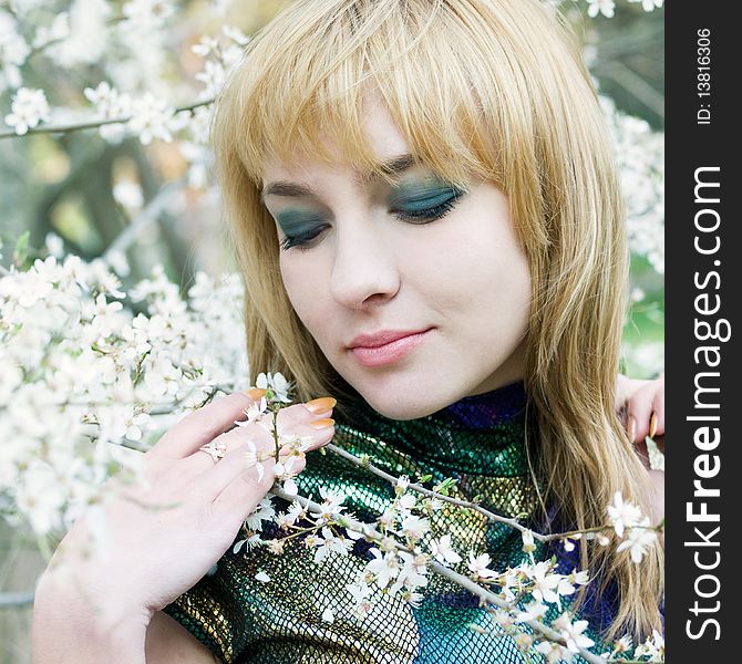 Beautiful young girl resting in spring garden. Beautiful young girl resting in spring garden