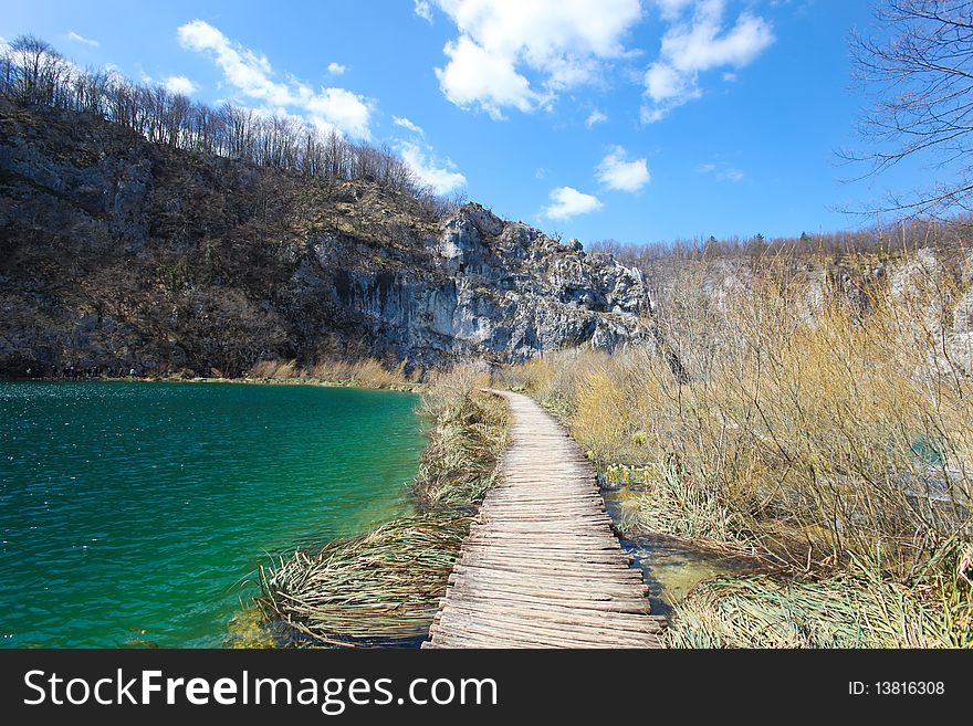 Wooden pathway through the falls at plitvice lakes in croatia