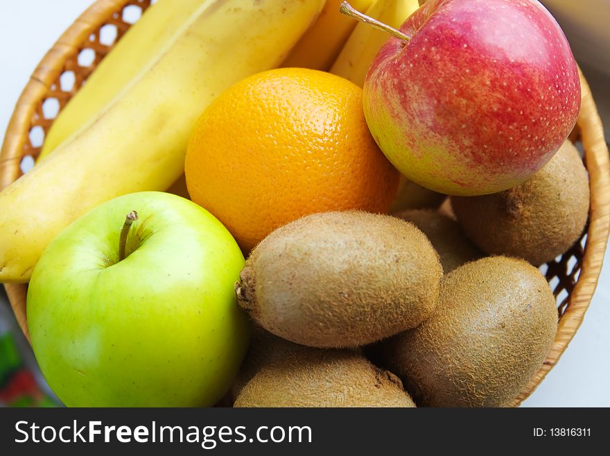 Fruit are in a small basket (background from fruit)