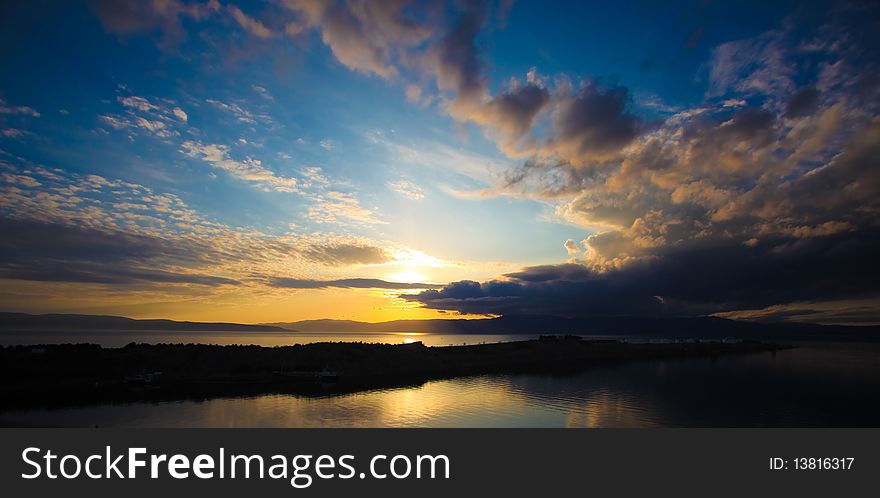 Sunset and clouds over the sea from Omisalj, Krk island, Croatia.