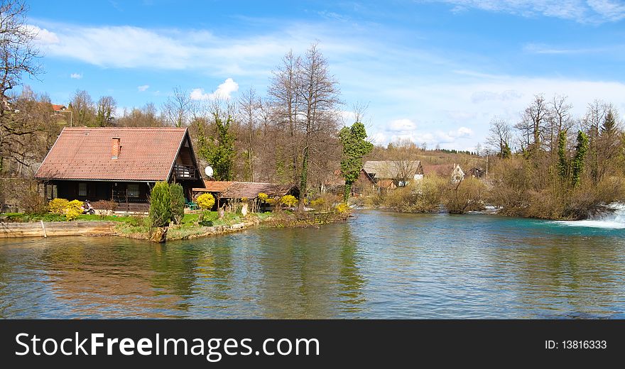 Wooden house on the side of river lake in Slunj, Croatia. Wooden house on the side of river lake in Slunj, Croatia