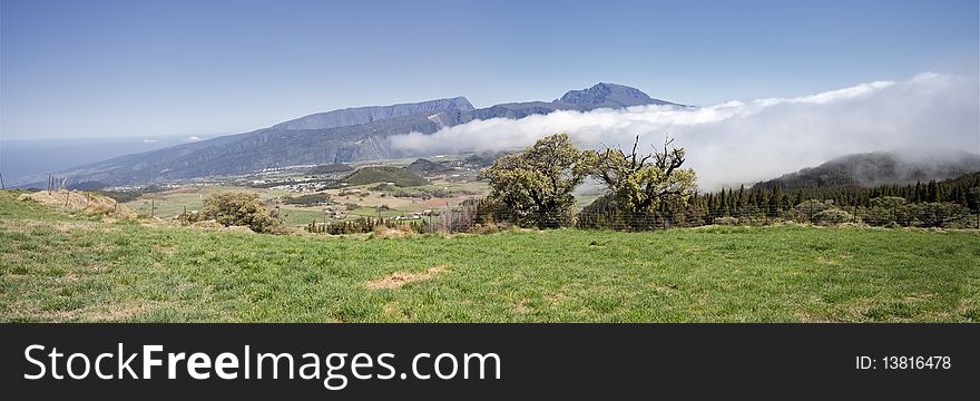 Landscape of plains and mountains under the clouds. Landscape of plains and mountains under the clouds