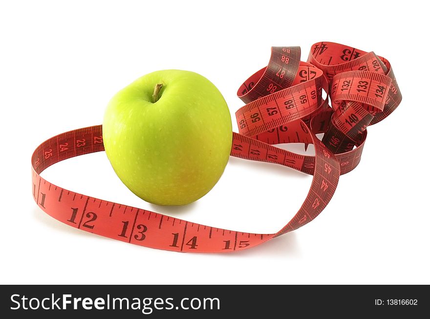 Green apple and pink measuring tape (centimetres and inches) on white background with shadow. Green apple and pink measuring tape (centimetres and inches) on white background with shadow.