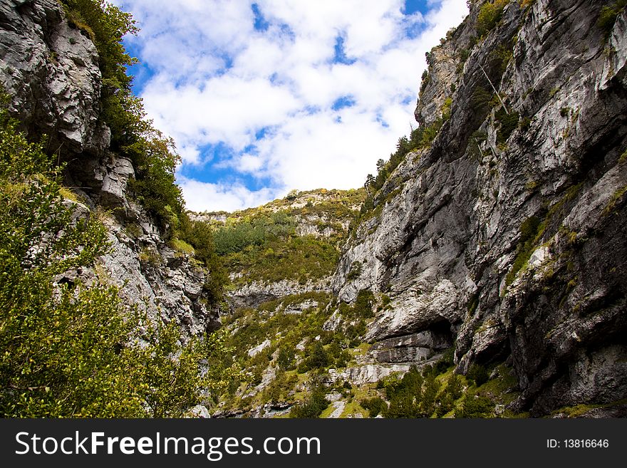 Big Canyon Anisclo in Ordesa Nation Park in Pyrenees, Spain. Autumn time. Big Canyon Anisclo in Ordesa Nation Park in Pyrenees, Spain. Autumn time.