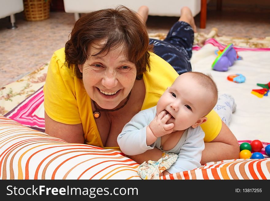 Grandmother with grandson are embraced and smile. Grandmother with grandson are embraced and smile