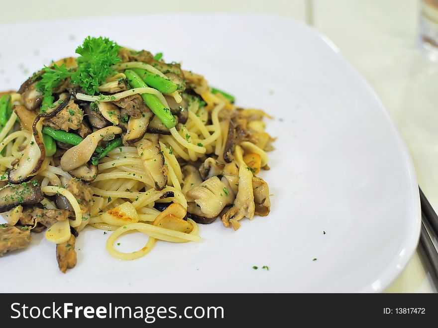 Close up shot of sumptuous looking vegetarian Aglio Olio spaghetti. Suitable for concepts such as food & beverage industry, and a healthy lifestyle. Close up shot of sumptuous looking vegetarian Aglio Olio spaghetti. Suitable for concepts such as food & beverage industry, and a healthy lifestyle.