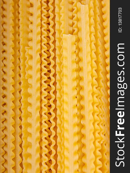 Traditional yellow spaghetti pasta closeup background. Traditional yellow spaghetti pasta closeup background