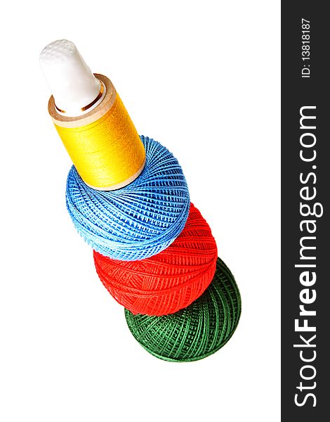 Colorful sewing balls in a stack isolated