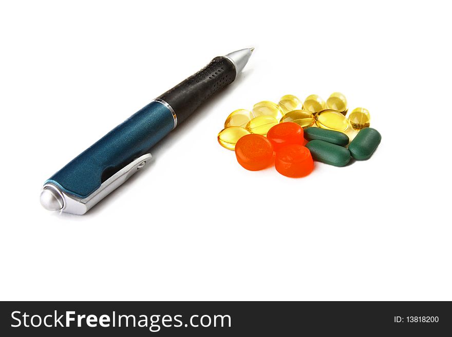 Heap Of Colorful Pills And A Pen