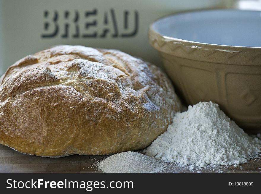 A Loaf Of Freshly Baked White Bread With Ingredients