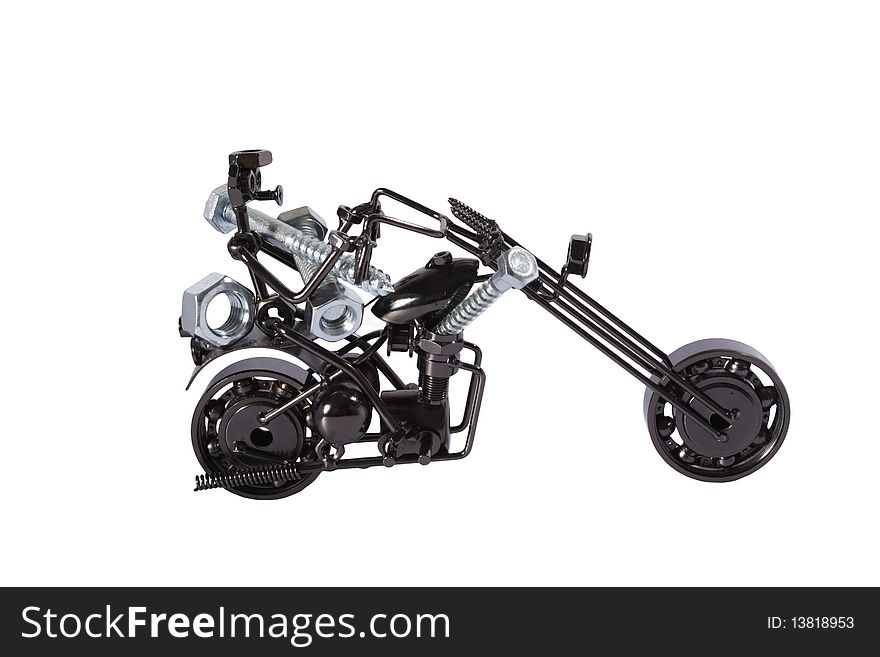 Toy  motorbike made from bolts and nuts carrying bolts and nuts