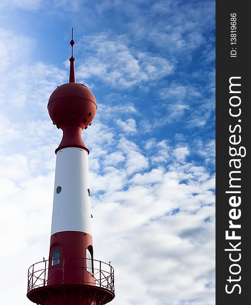 Top of the Lighthouse on cloudy sky