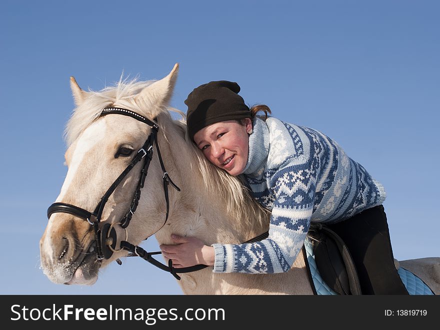 Young girl on horseback of the white horse
