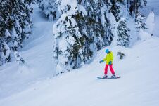 Girl Snowboarder Having Fun In The Winter Ski Resort. Royalty Free Stock Image