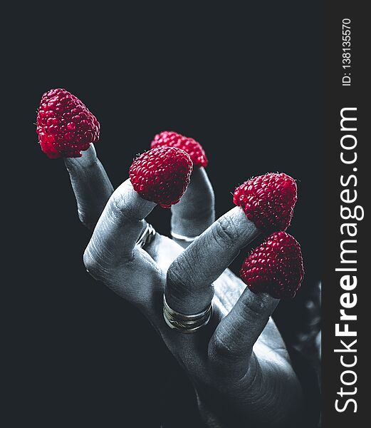 Fingers With Raspberry