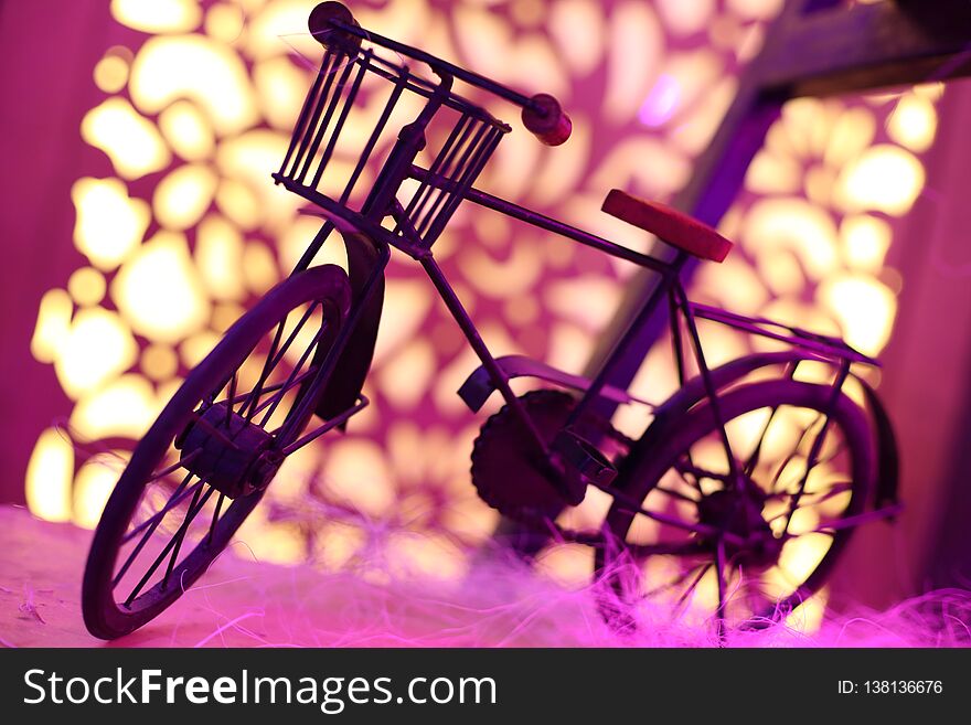 Small and cute artistic vintage bicycle with bright and blur background