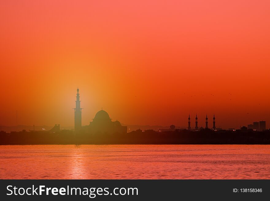Silhouette of a mosque at sunrise