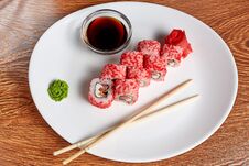 Rolls With Salmon And Cream Cheese And Tomatoes Lie On A White Plate That Has More Wasabi, Pickled Ginger, Soy Sauce And Wooden Stock Images Rolls With Salmon And Cream Cheese And Tomatoes Lie On A White Plate That Has More Wasabi, Pickled Ginger, Soy Sauce And Wooden Stock Images